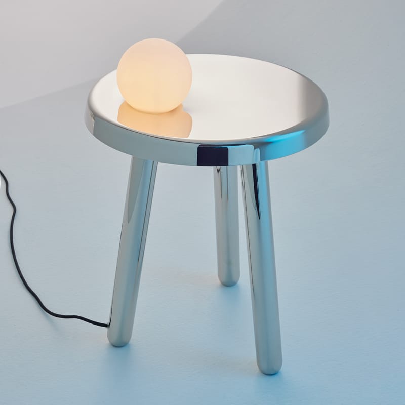 round nightstand table with spherical lamp on top